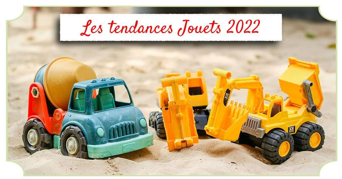 Jouets (camion et pelleteuse) dans un bac à sable